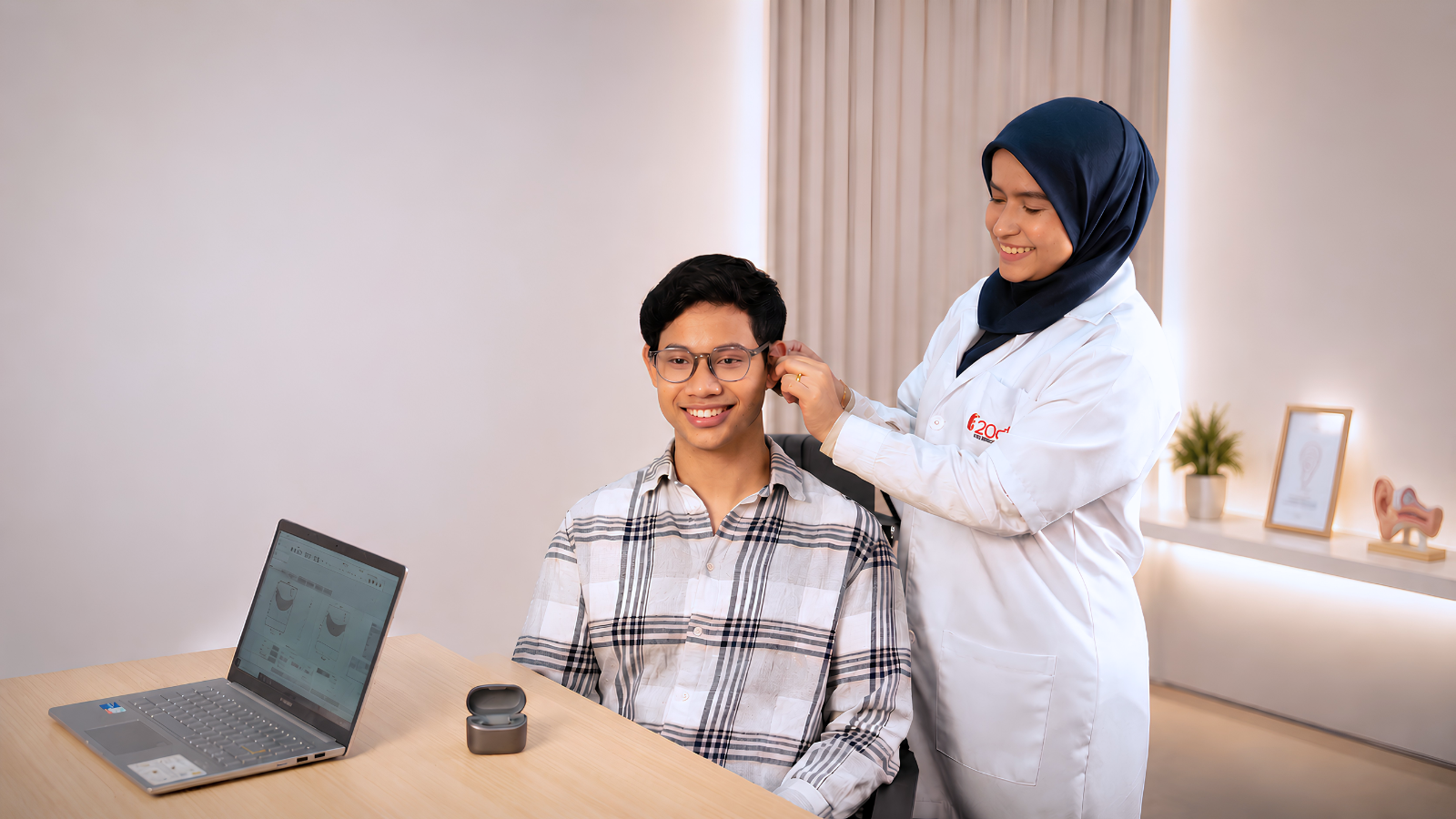 20dB Audiologist conducting hearing check